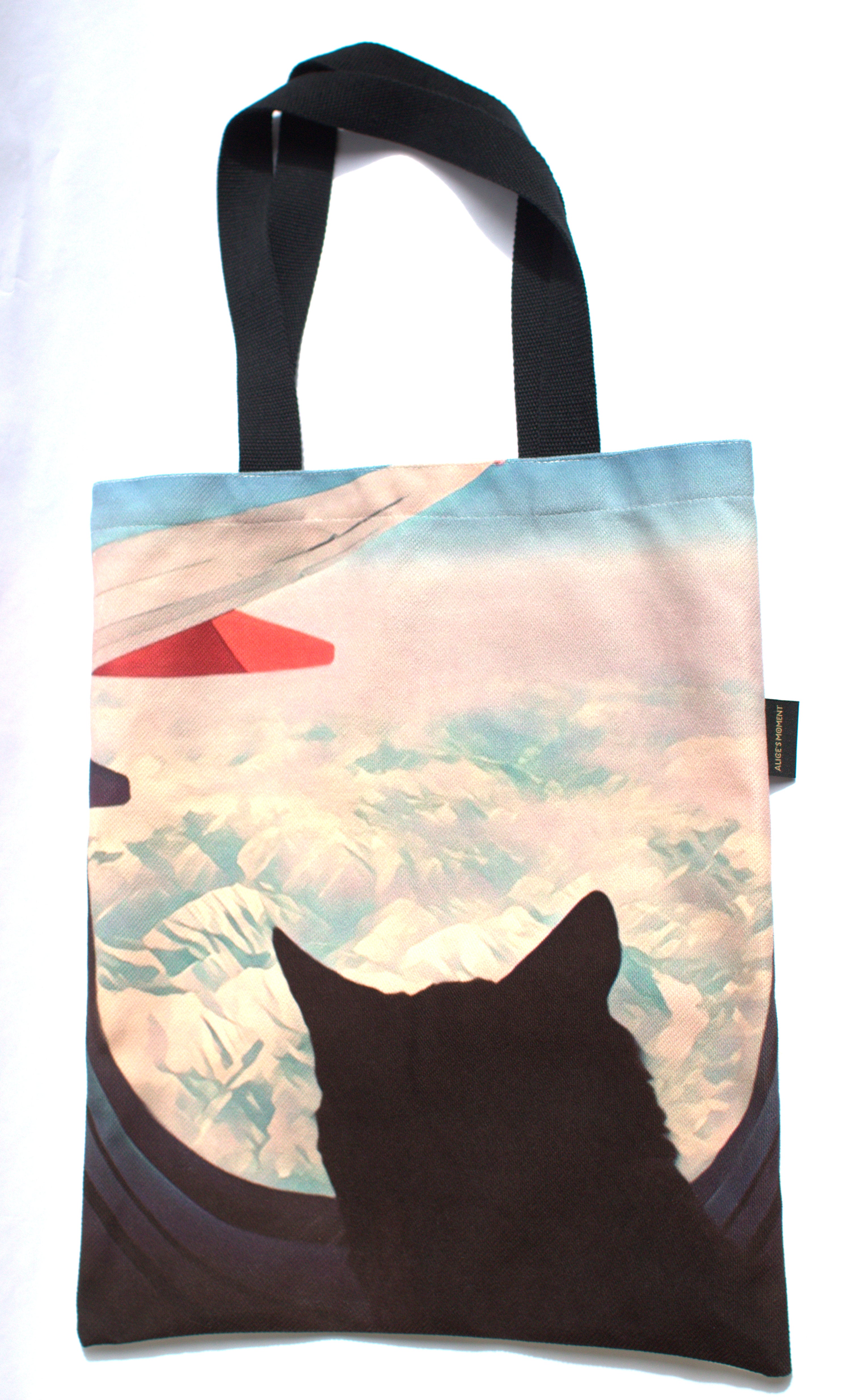 Alice in Wonderland playing with cute cat and butterflies Tote Bag